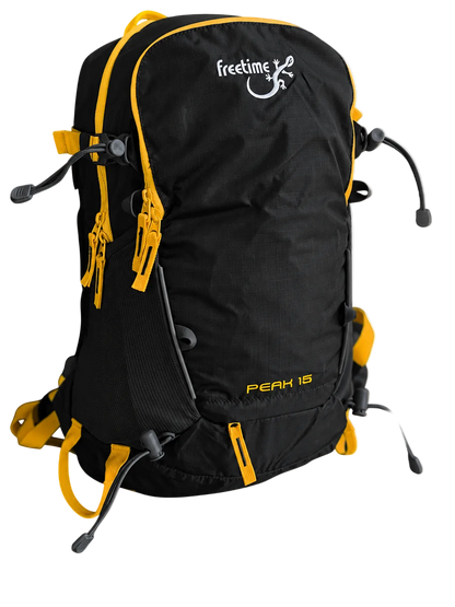 Sac à dos ultra léger Peak 15 litres - vue de trois-quart - gris foncé avec sangles jaunes.
