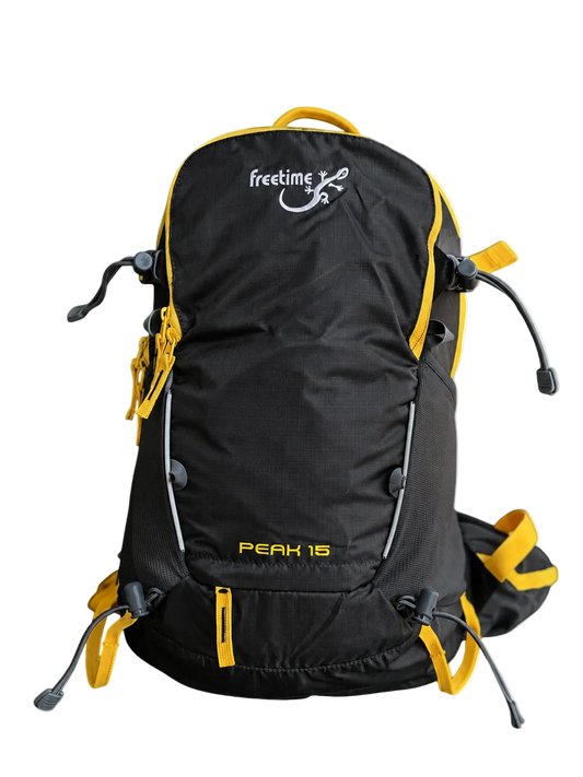 Sac à dos ultra léger Peak 15 litres - vue de devant - gris foncé avec sangles jaunes.