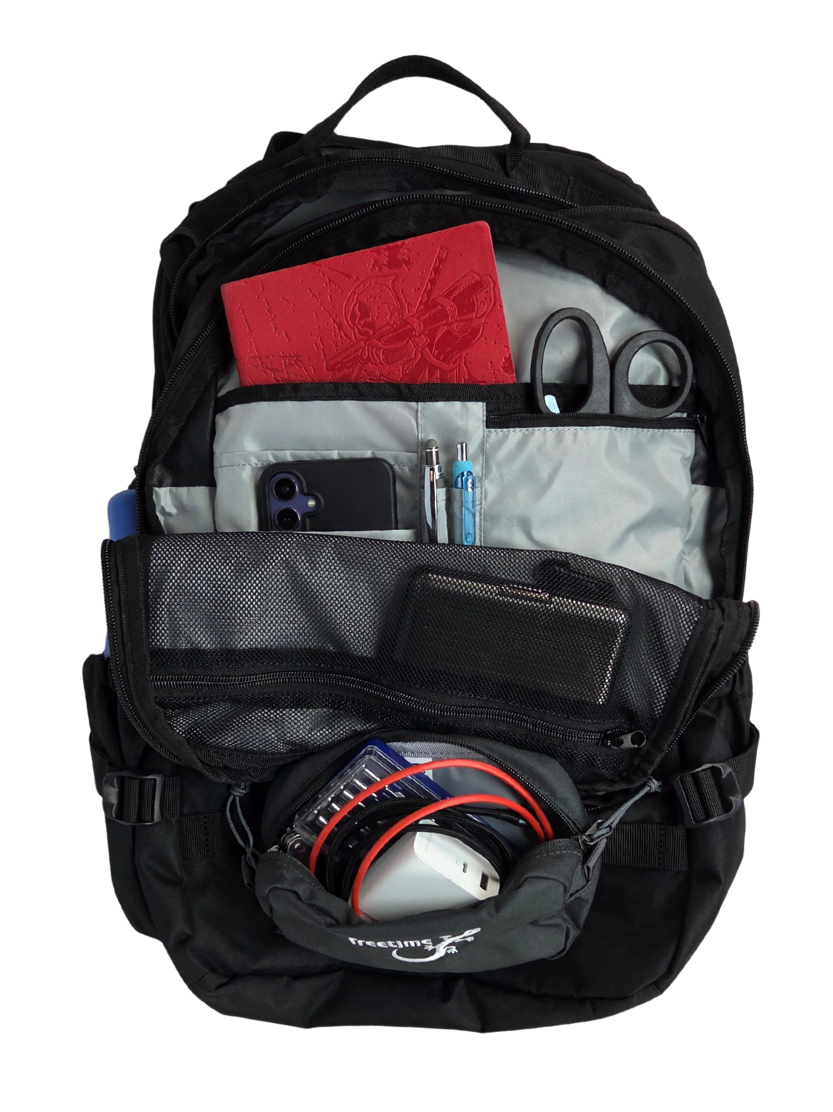 Sac d'évacuation Mangouste 32, marque Freetime, capacité 32 litres - sac noir avec système MOLLE et compartiment ordinateur, vue sur compartiment intérieur avant avec petits équipements