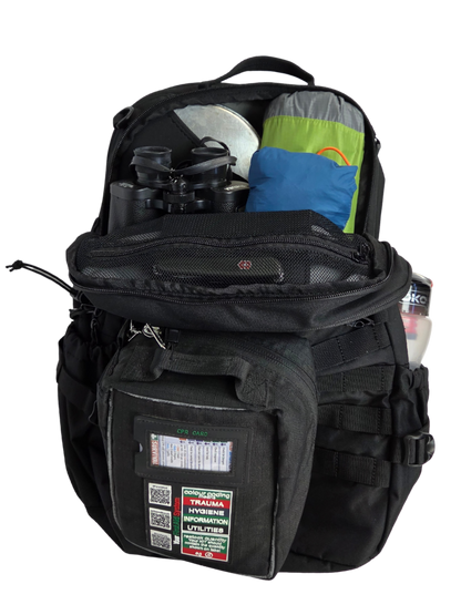 Sac d'évacuation Mangouste 32, marque Freetime, capacité 32 litres - sac noir avec système MOLLE et compartiment ordinateur, vue sur compartiment intérieur principal avec popote, jumelles, équipement de bivouac.